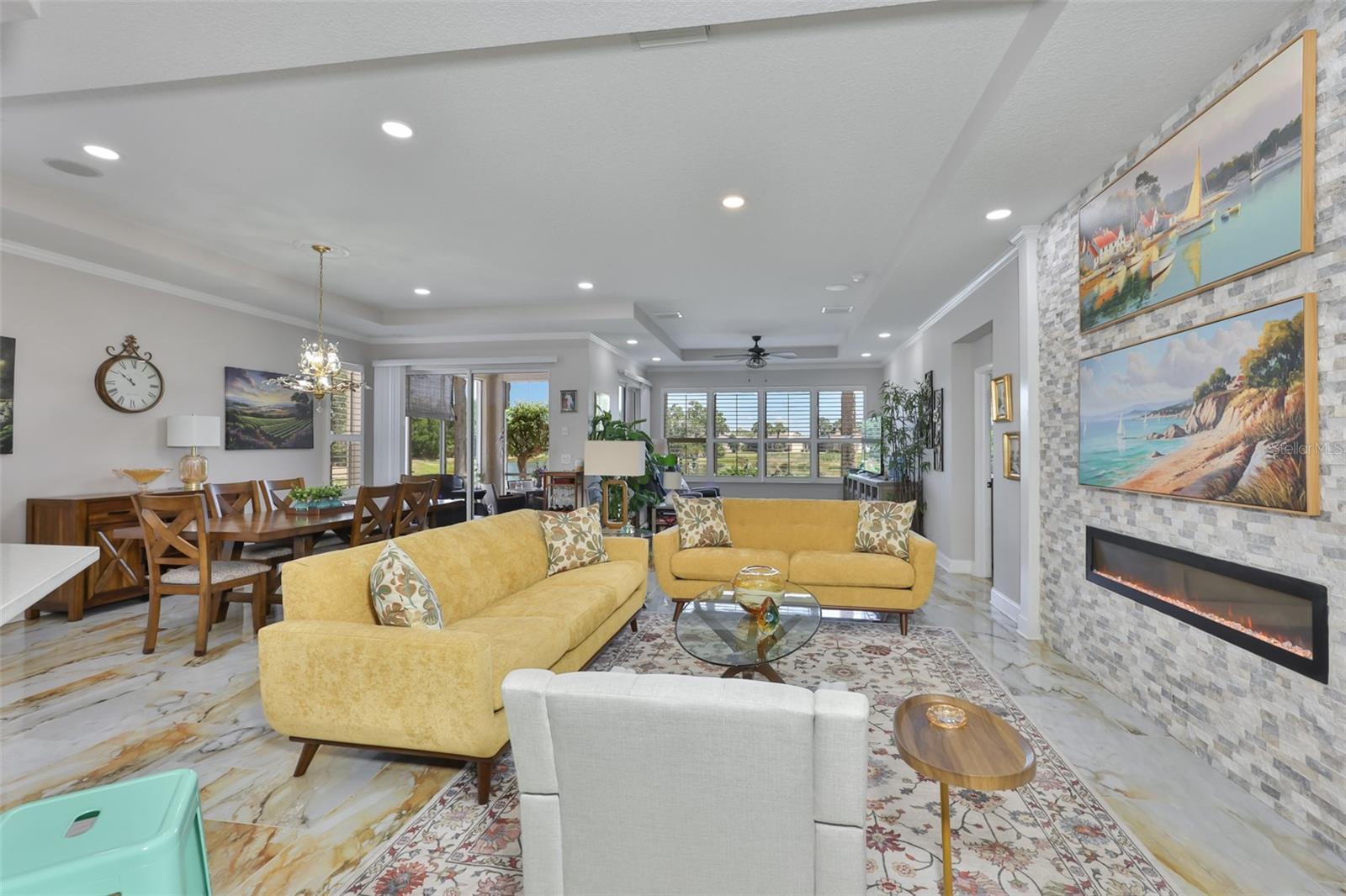 A truly open and spacious floor plan make for a comfortable and inviting space.  Notice the recessed lighting and trey ceilings.