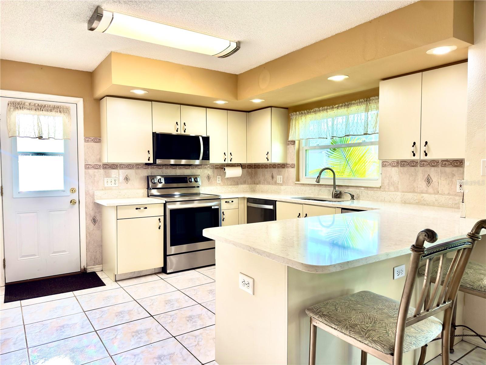 Large eat in kitchen next to formal dining room