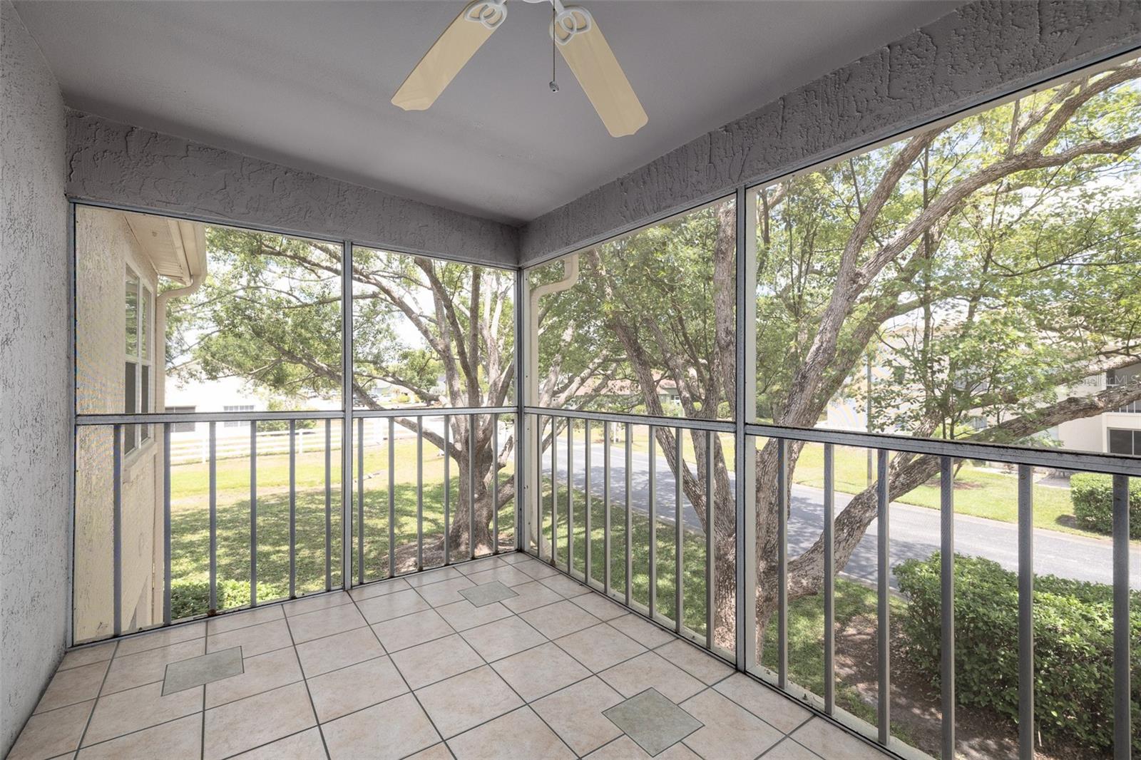 Large patio, tile, ceiling fan, screened-in