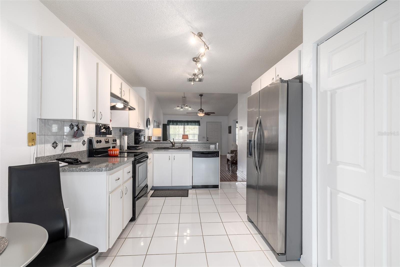 Kitchen with tile flooring, Eat-in Dining Space, Walk-in Pantry/closet