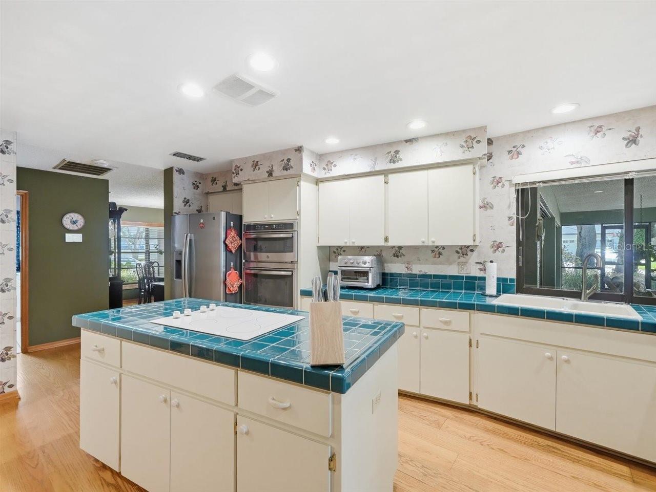 Eat in area plus views of hallway to bedrooms 2 and 3. Laundry room is off to the right.