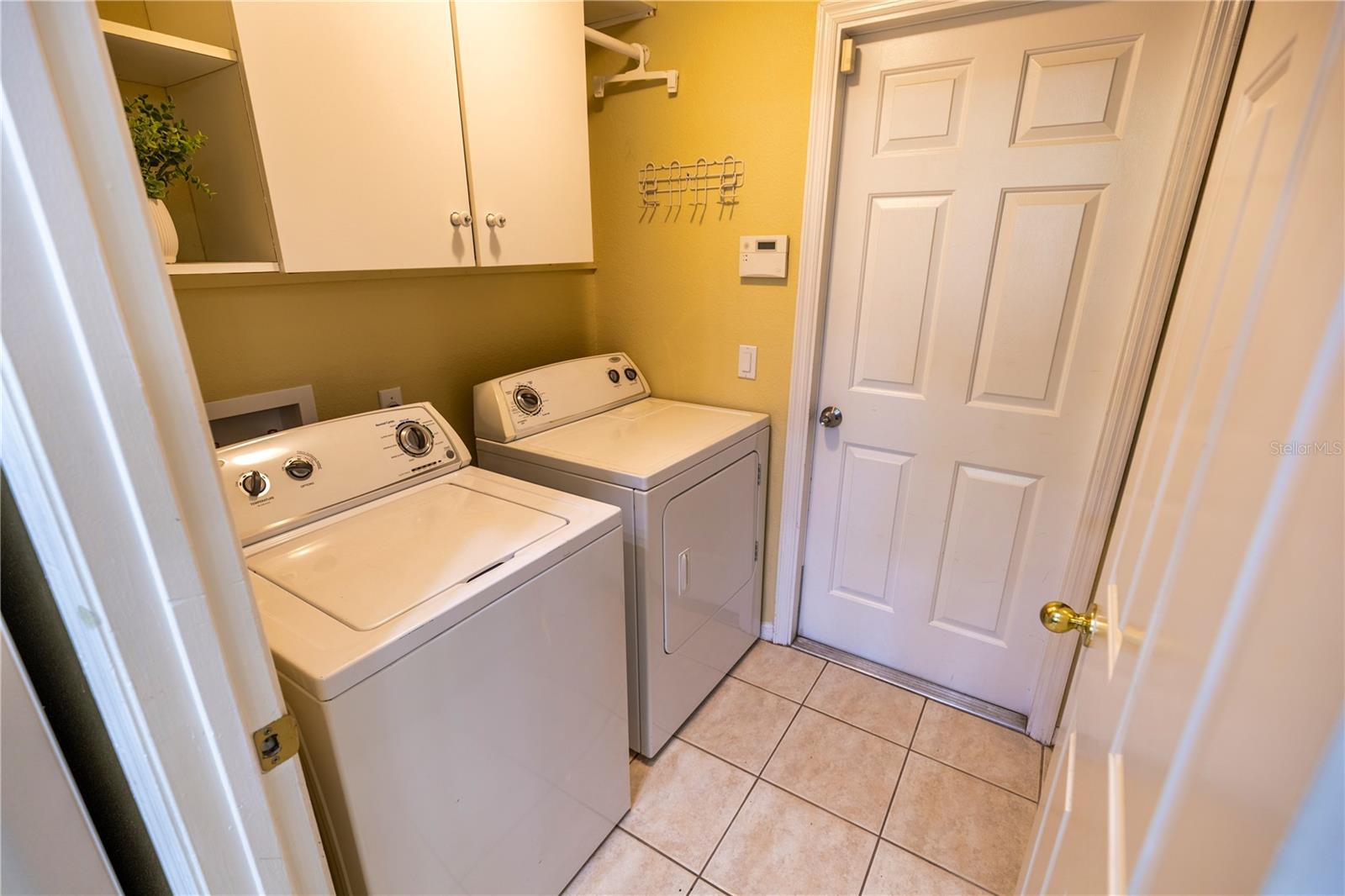Laundry room with cabinets; Washer and dryer are included in your purchase