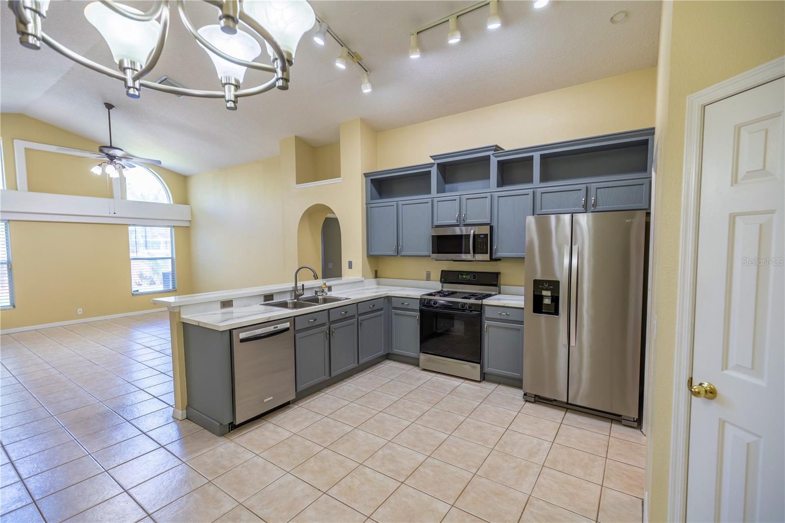 Kitchen with gas stove, refrigerator with ice maker, eat-in breakfast area, spacious closet pantry and room for a prep island