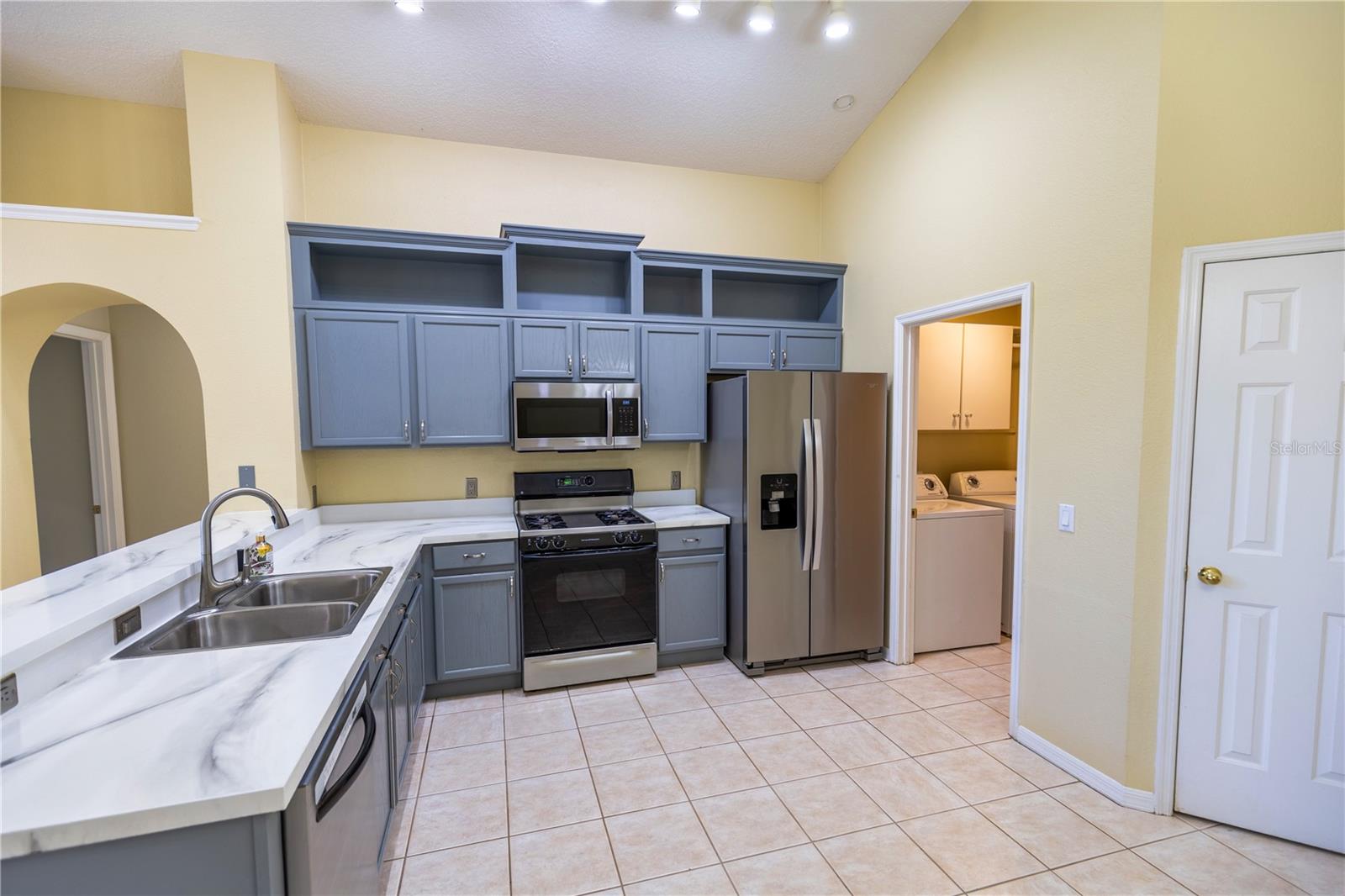 Easy kitchen access through laundry room from garage