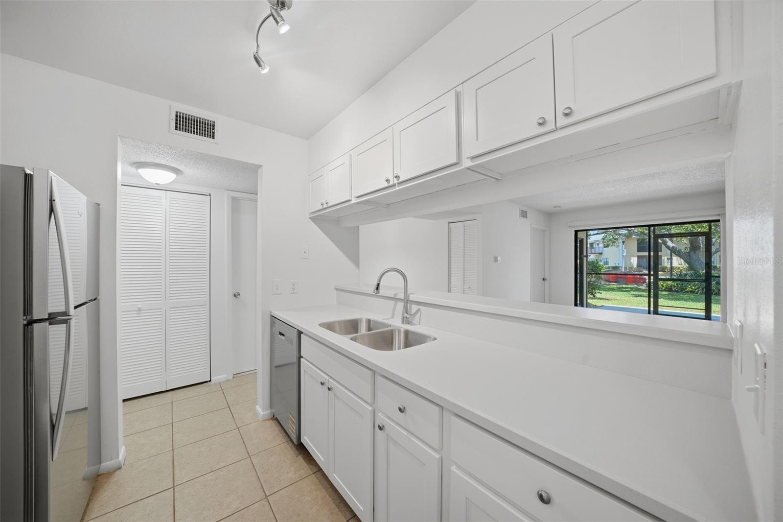 New updated kitchen with solid surface counters