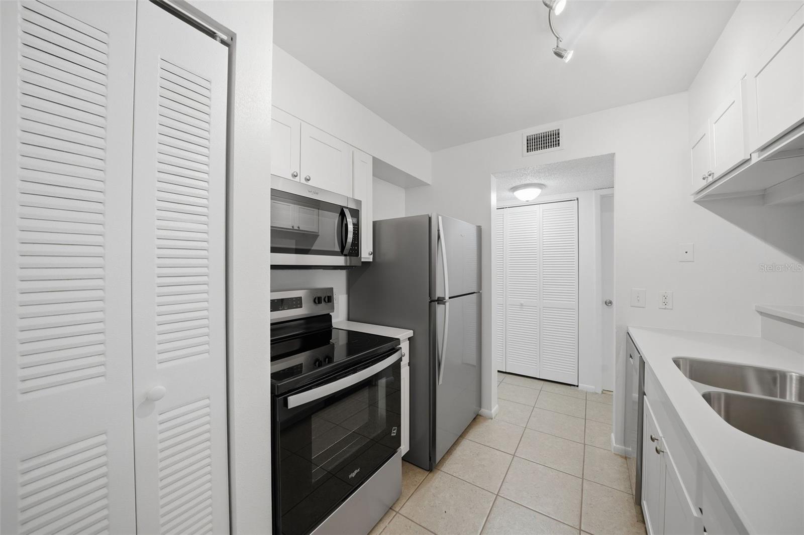 New updated kitchen with solid surface counters