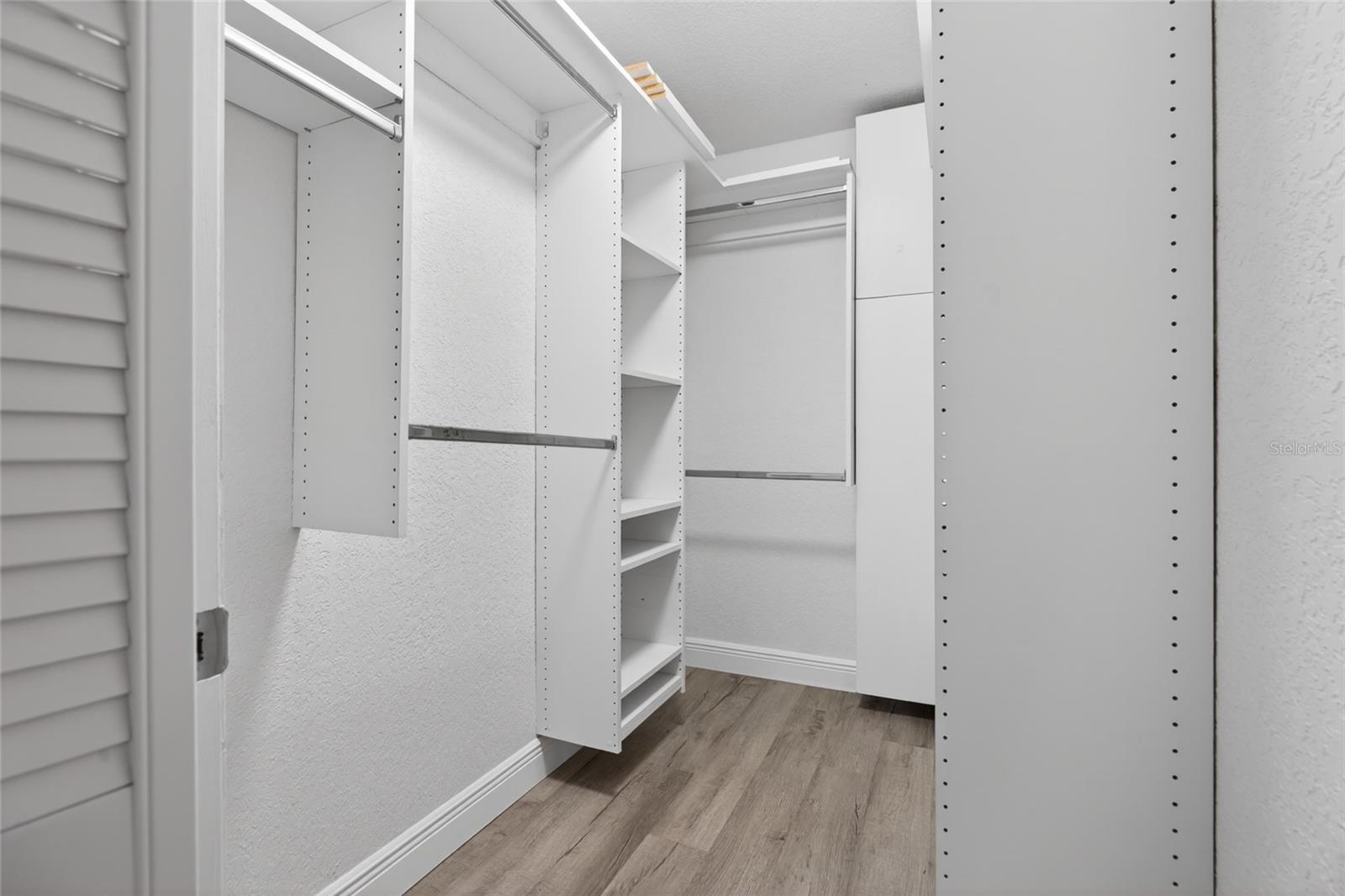 Walk-in closet in the primary bedroom.