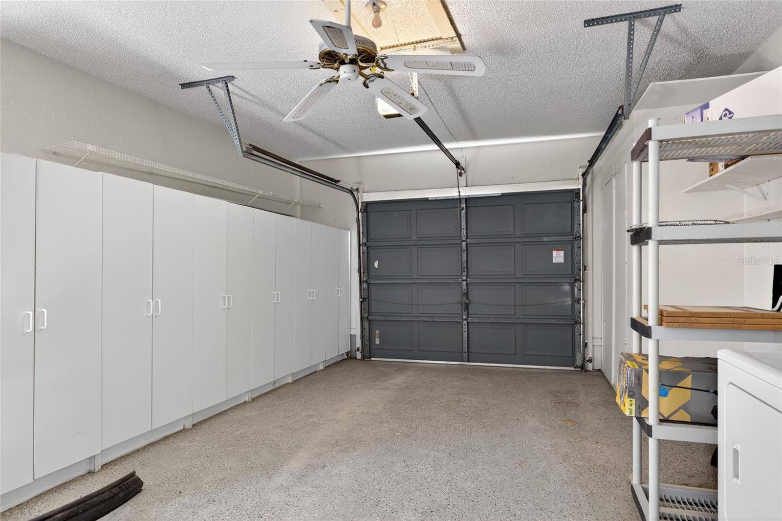 Garage has plenty of storage.
