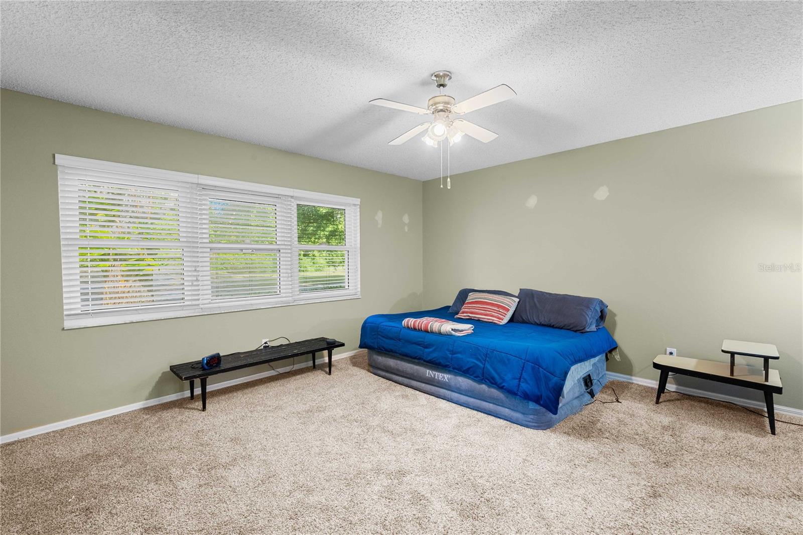 Primary bedroom with view of golf course