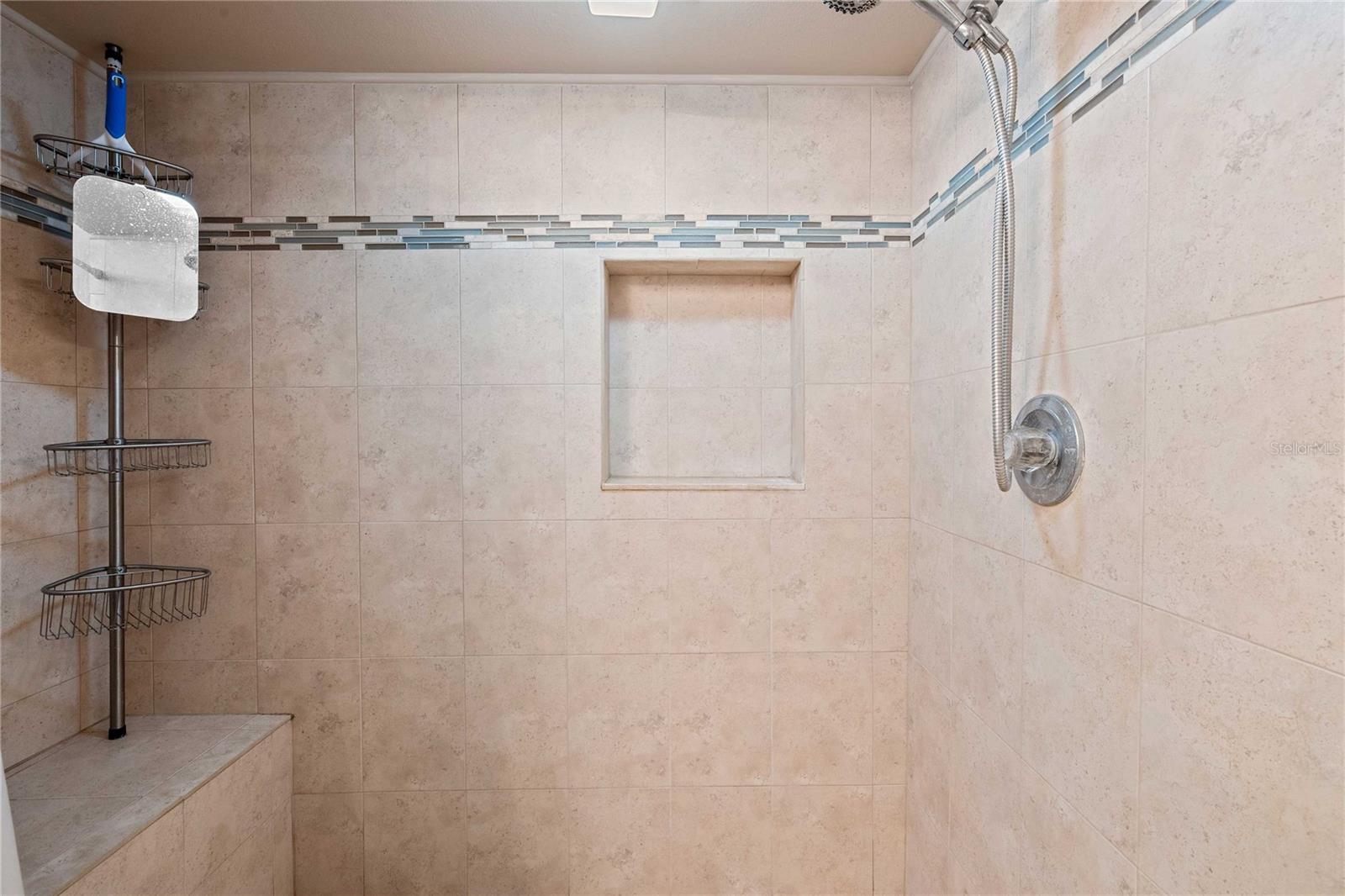Nice tile shower in primary bathroom