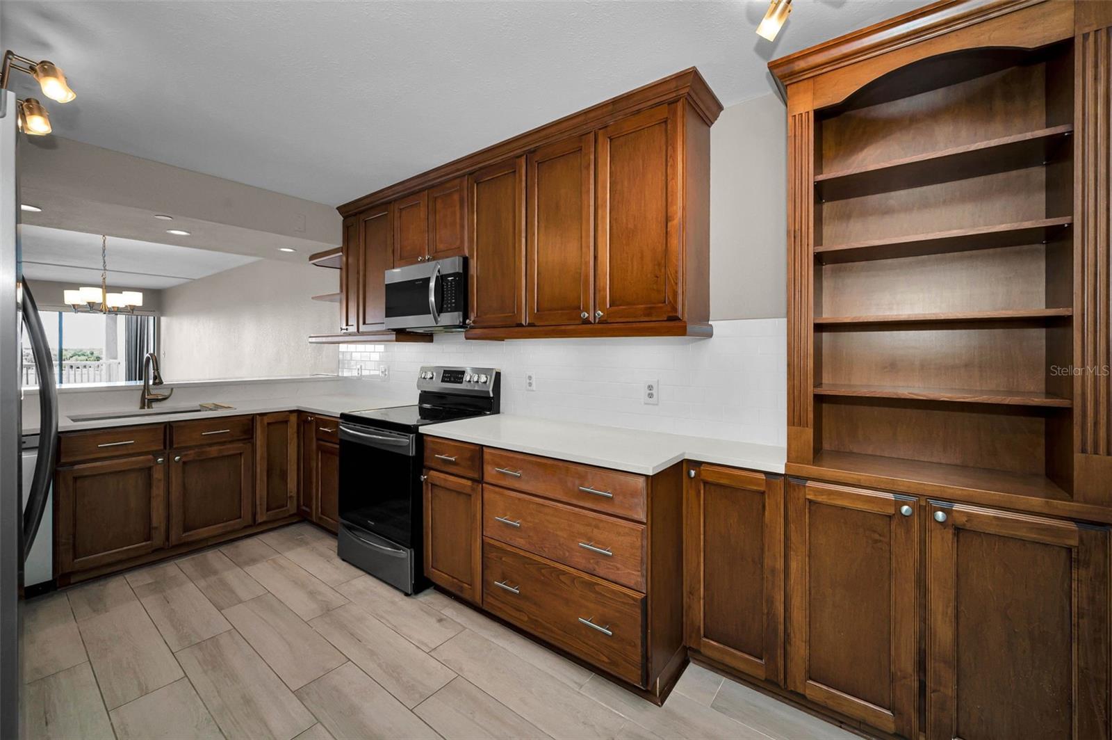 KITCHEN WITH AN ABUNDANCE OF WOOD CABINETRY - PLENTY OF STORAGE!