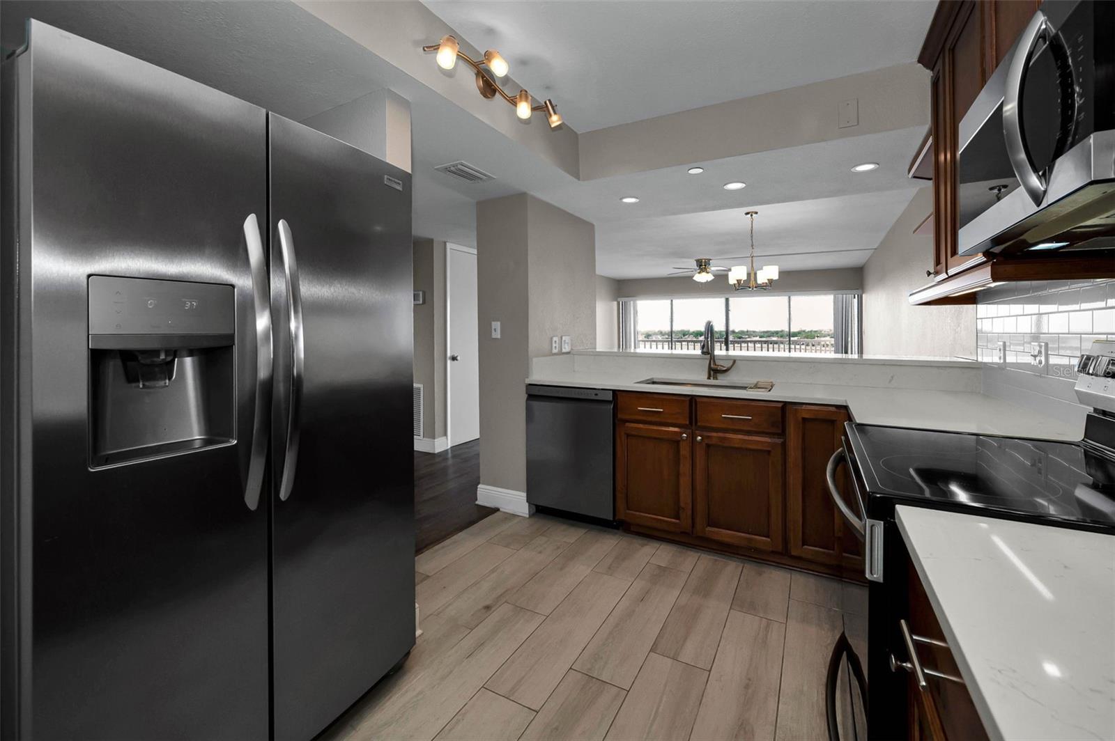 QUARTZ COUNTERS AND LVP FLOORING