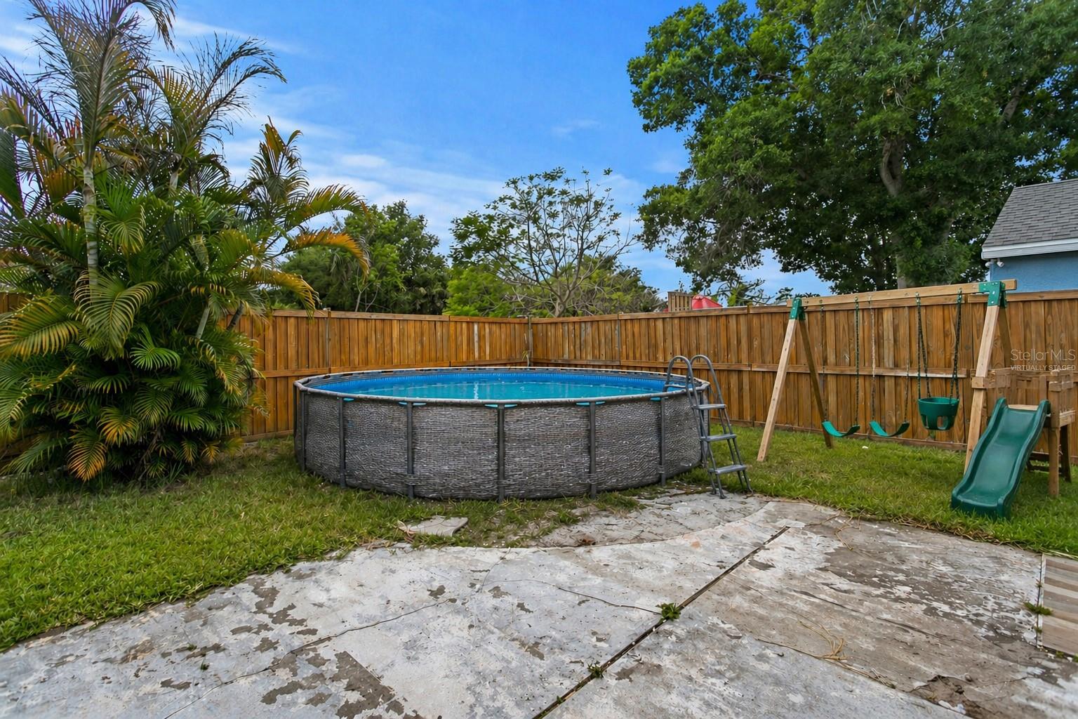 What the Back Yard Could Become With Pool - Virtually Staged
