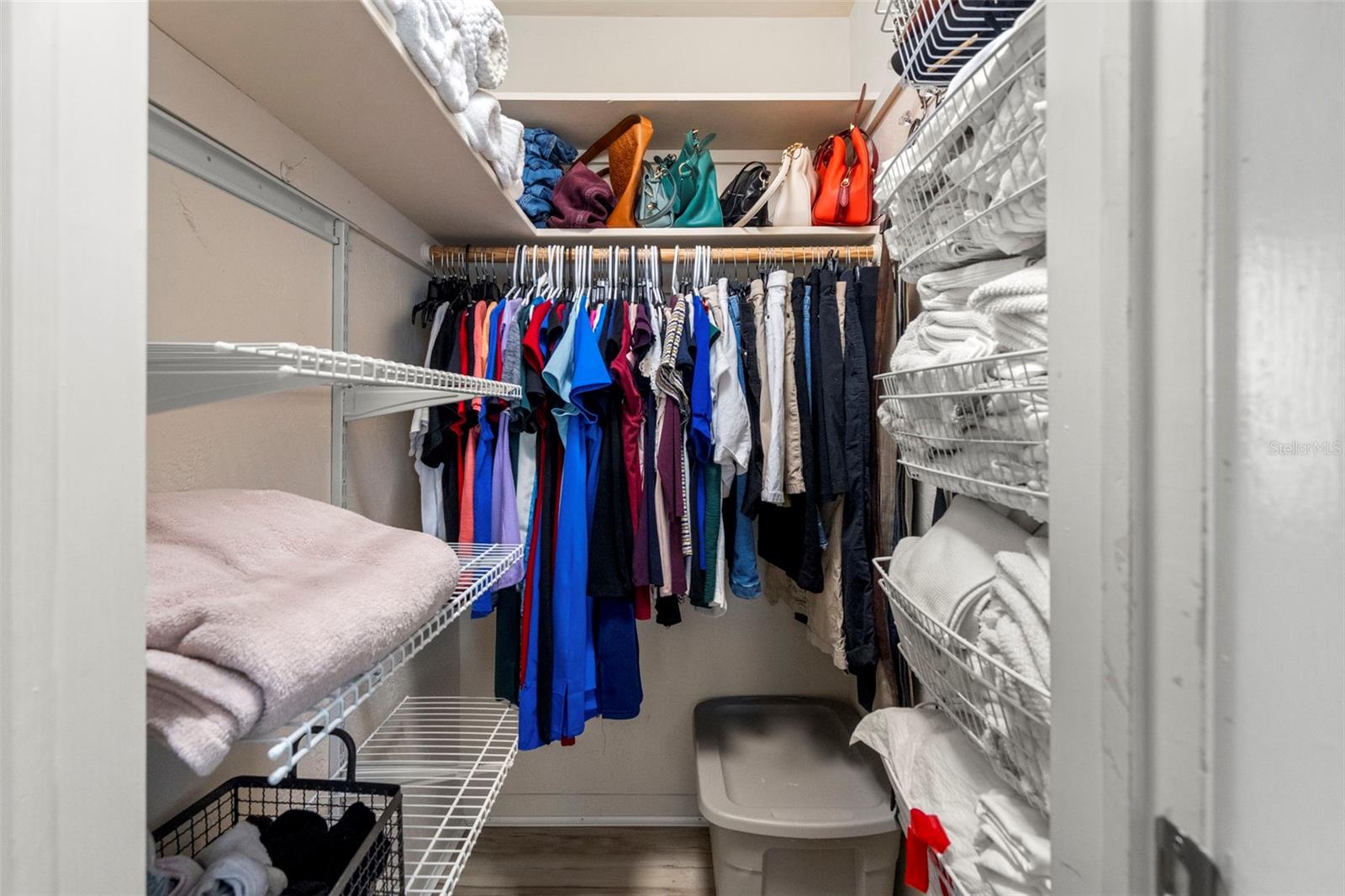 Primary bedroom walk-in closet
