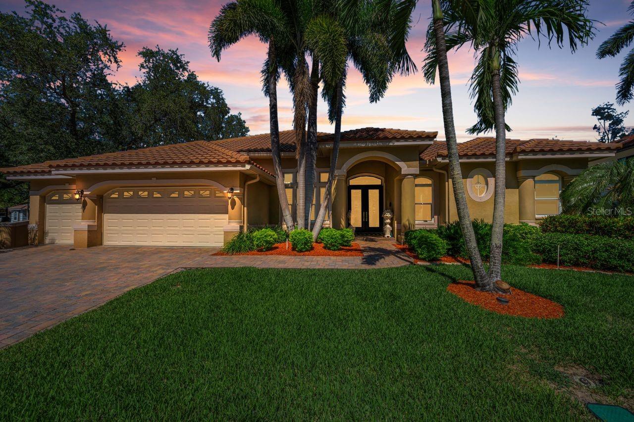 Large Home with Lush Tropical Landscape & Extra Garage Space
