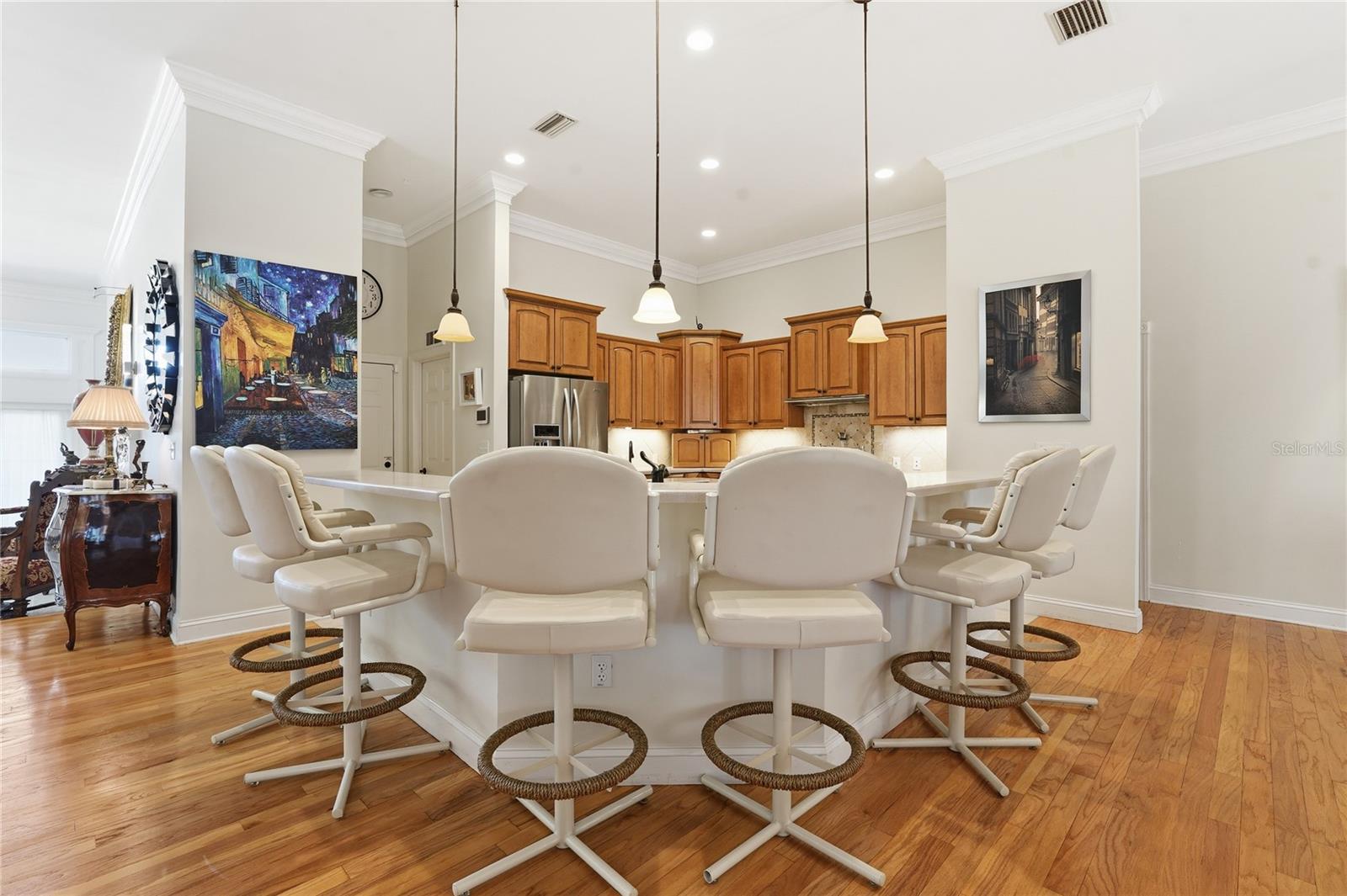 THE KITCHEN HAS A BREAKFAST BAR THAT CAN SEAT 6