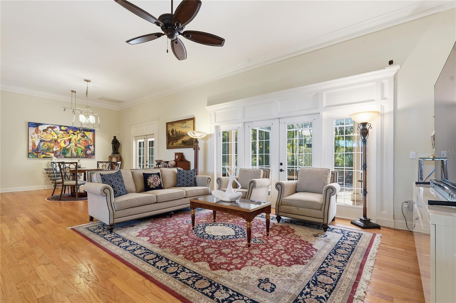 THIS FAMILY ROOM EXPANDS INTO THE OUTSIDE AREA WITH FRENCH DOORS