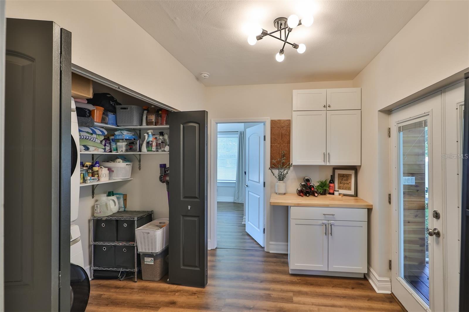 Ample laundry closet, key for organizing.