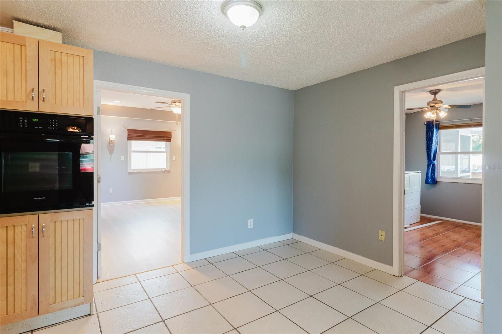 Part of kitchen/dining area with two bedrooms entries