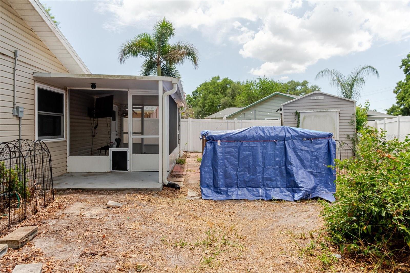 Backyard with swim spa and screen porch