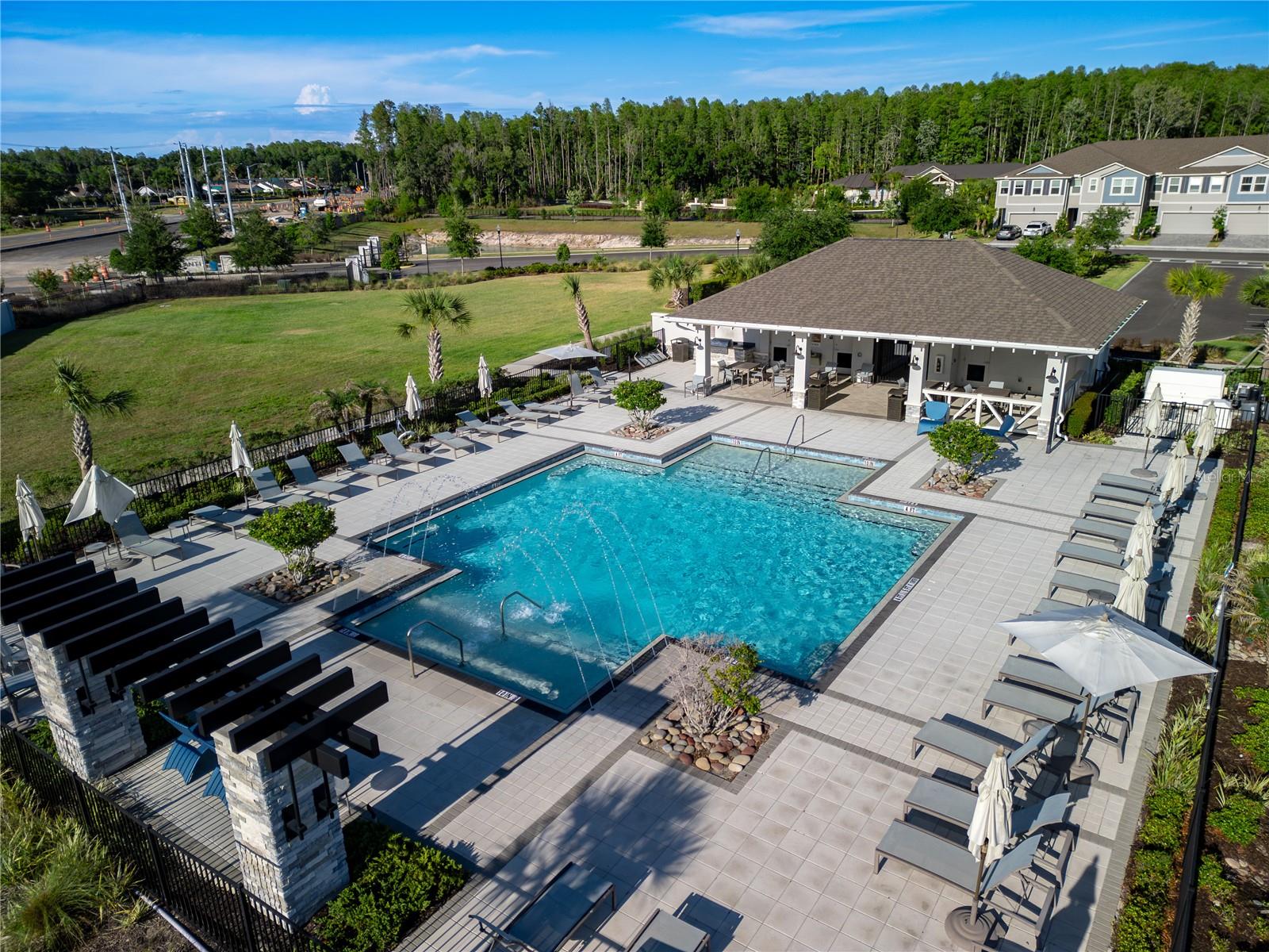 Community pool with lounge tables