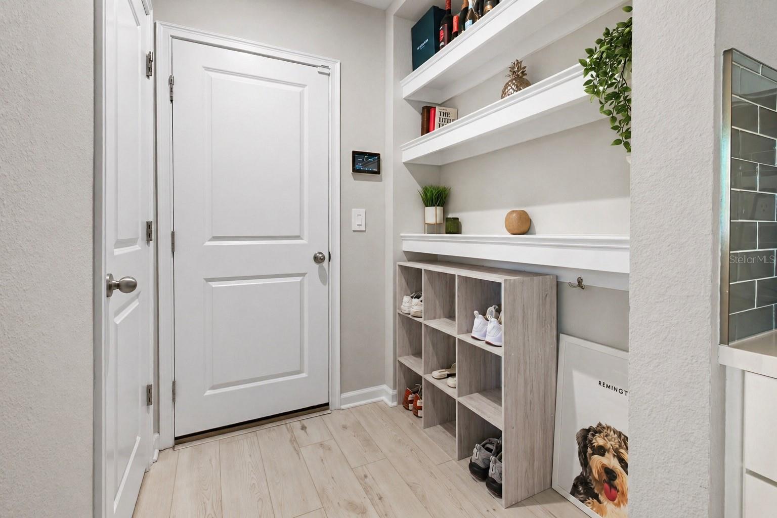 Built-in drop done with garage entrance + pantry (door to the left of the picture)