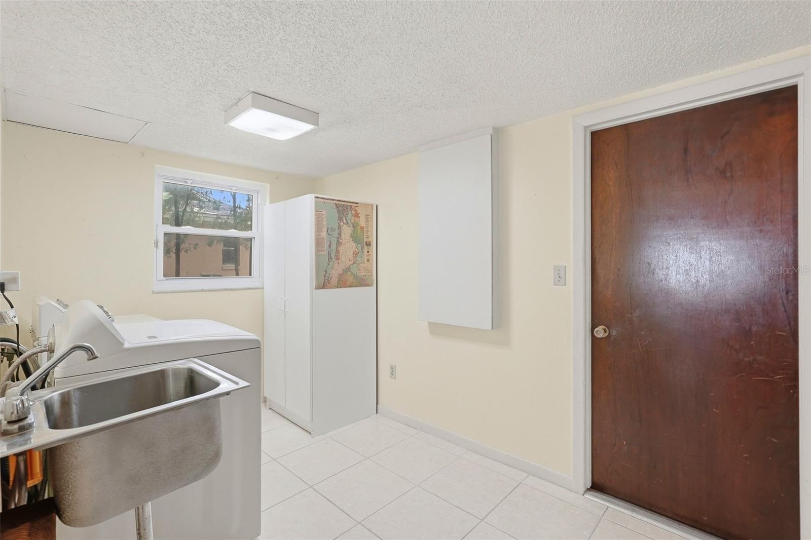 Inside Laundry Room and door to the garage.