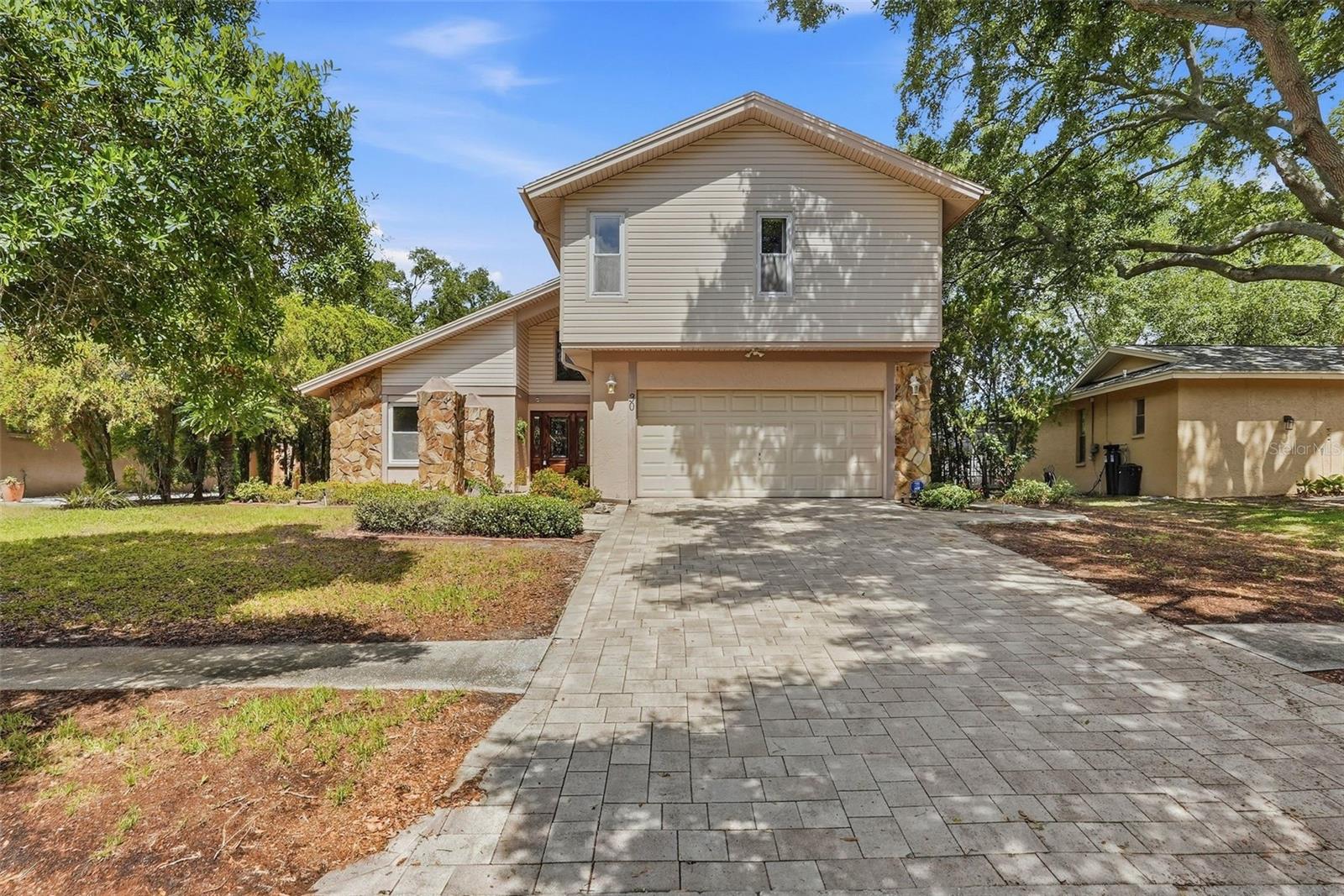 Front of 30 Turnstone.  Check out the pavers on the driveway.