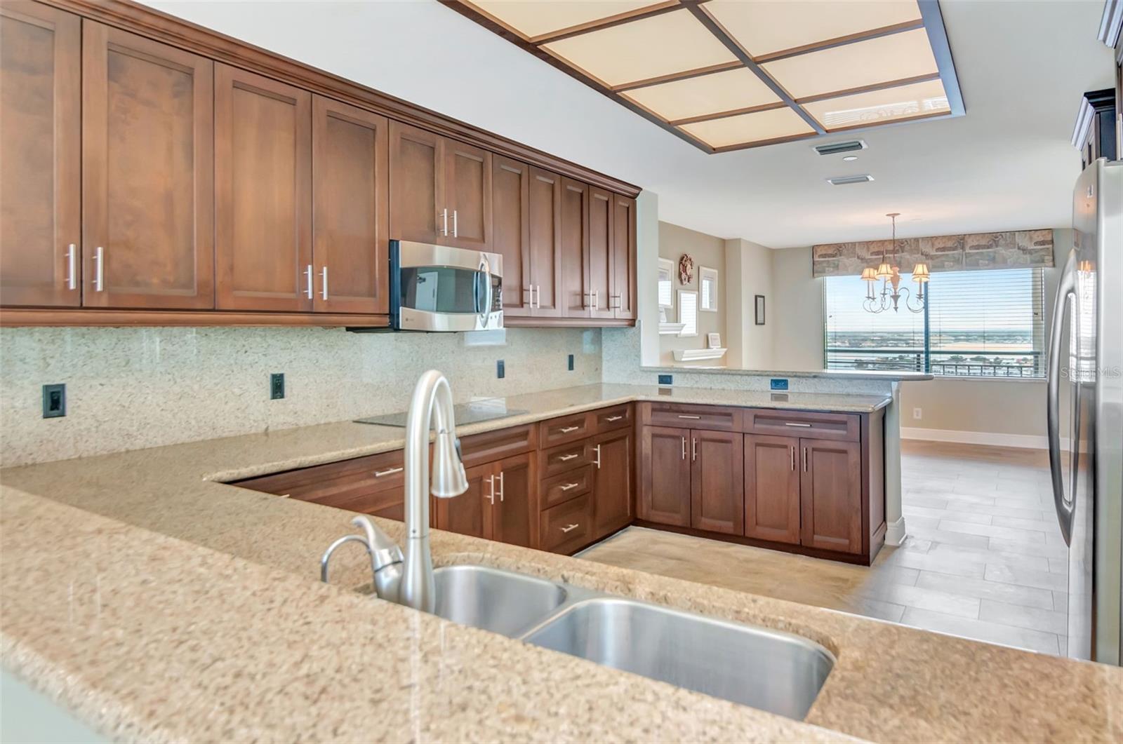 Beautiful cabinets with granite countertops and GE profile upscale appliances