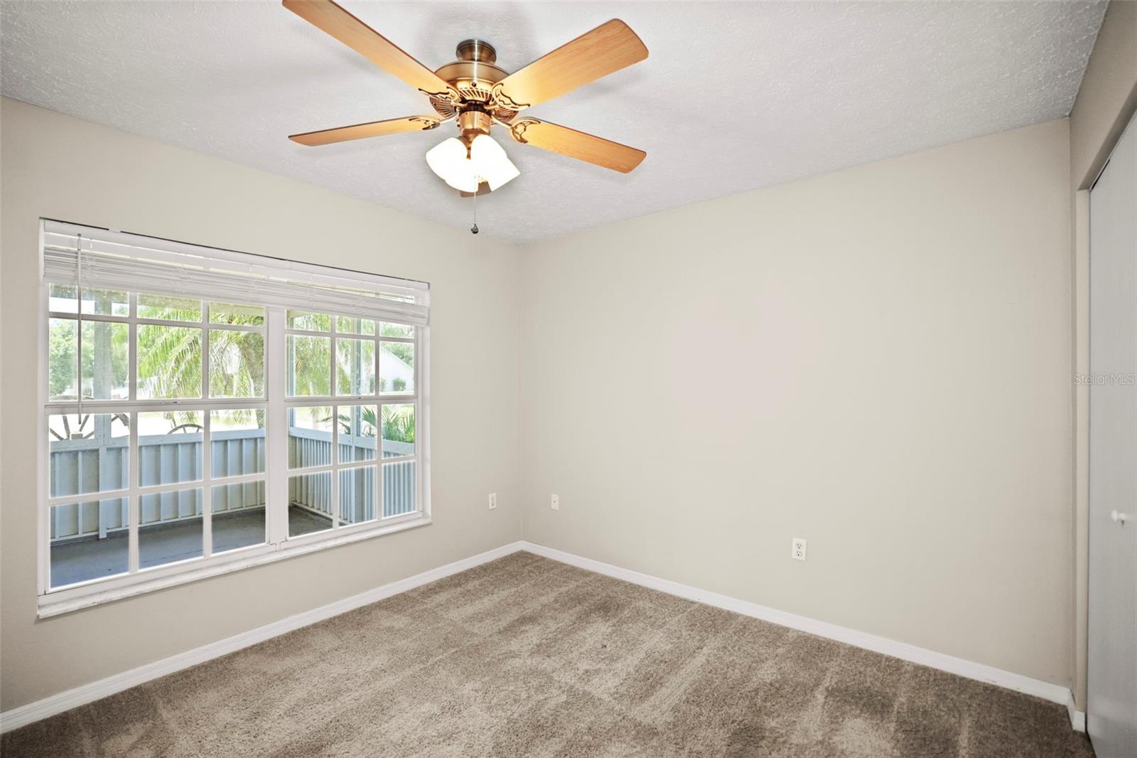 Bedroom 3 with large window that allows natural light and built in closet.
