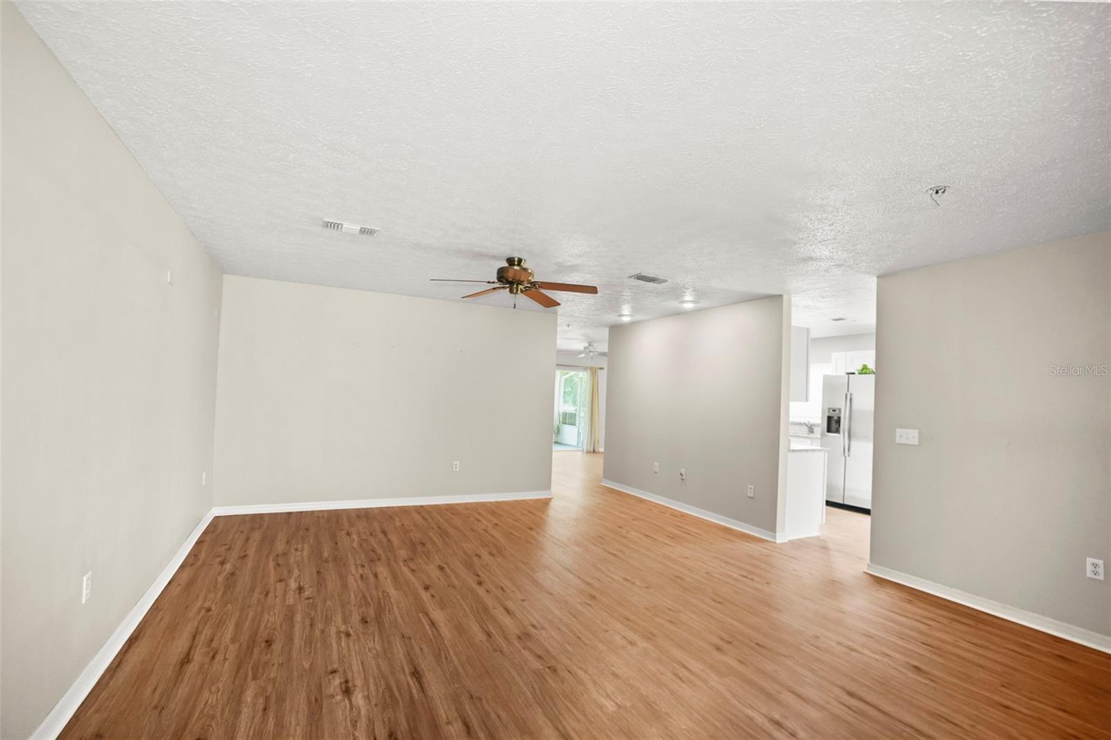 Spacious Livingroom from the front door with a view of the kitchen