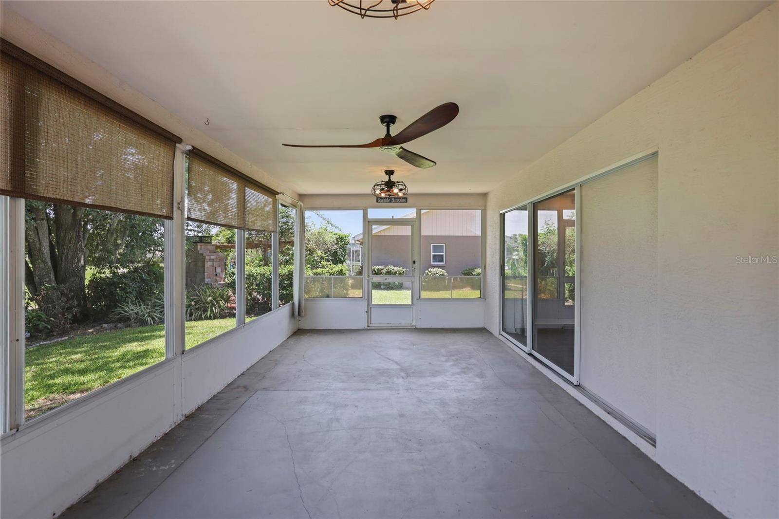 Enclosed rear porch with panoramic views of the golf course