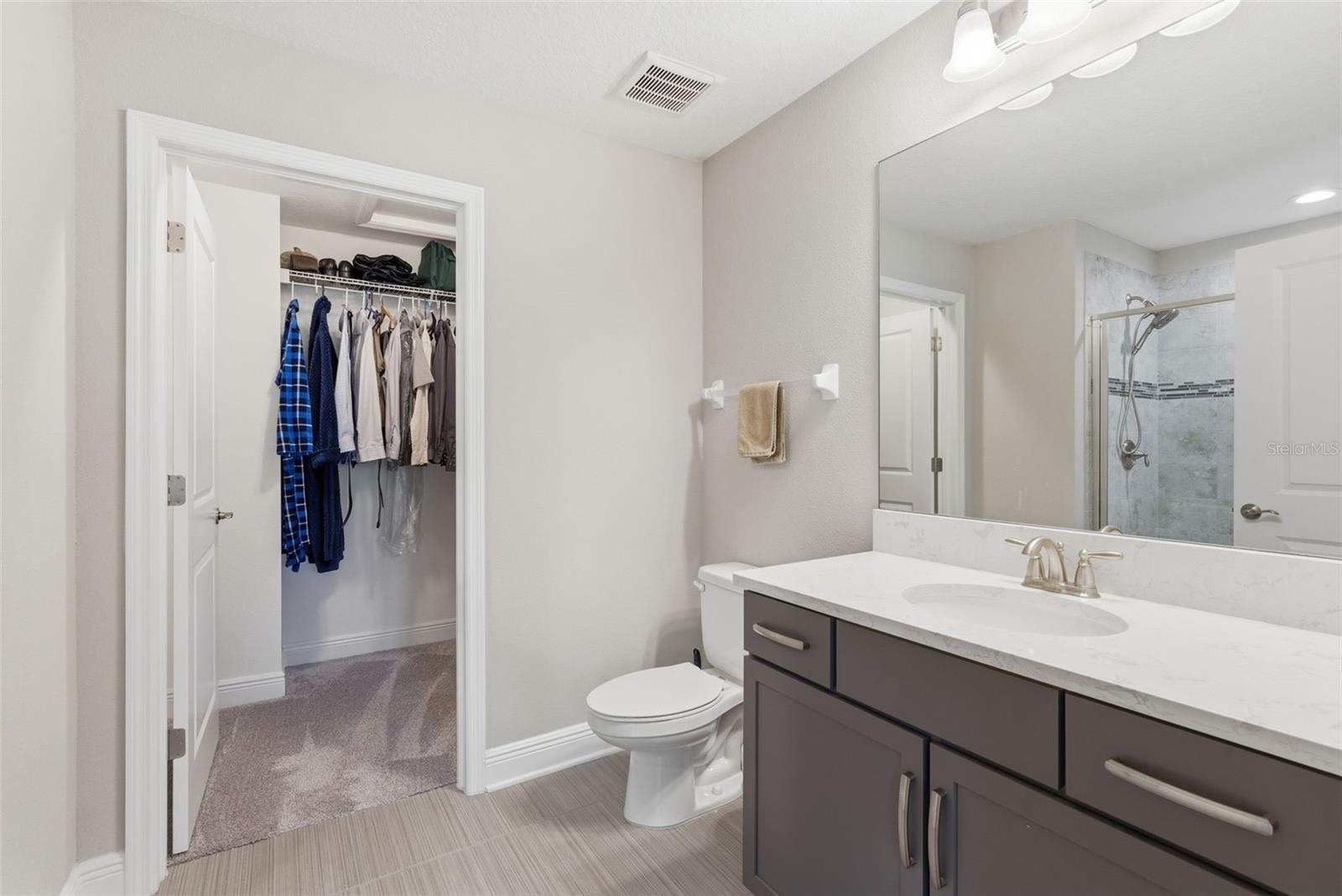 big closet attached to bathroom in primary room
