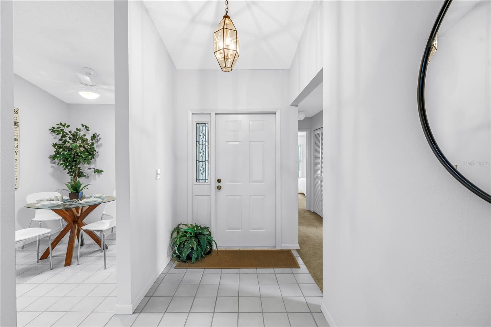 Front Door perspective with split front bedroom to the right and kitchen to the left