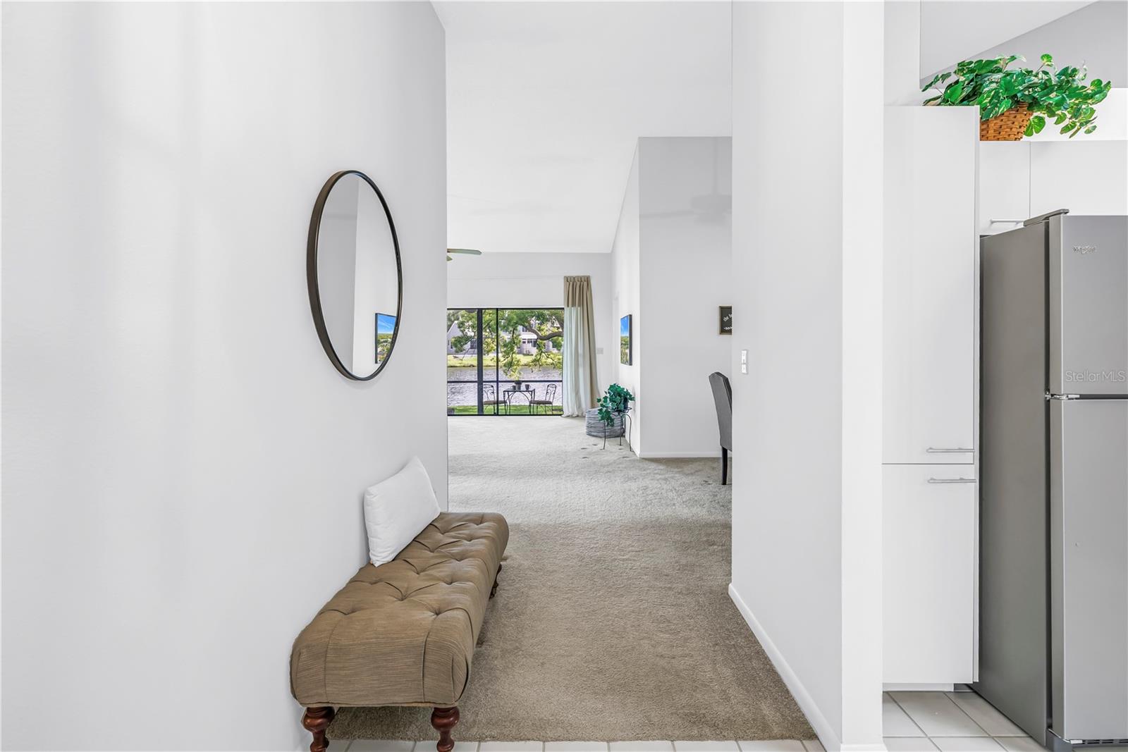 Entry Foyer presents the lake front views and screened porch