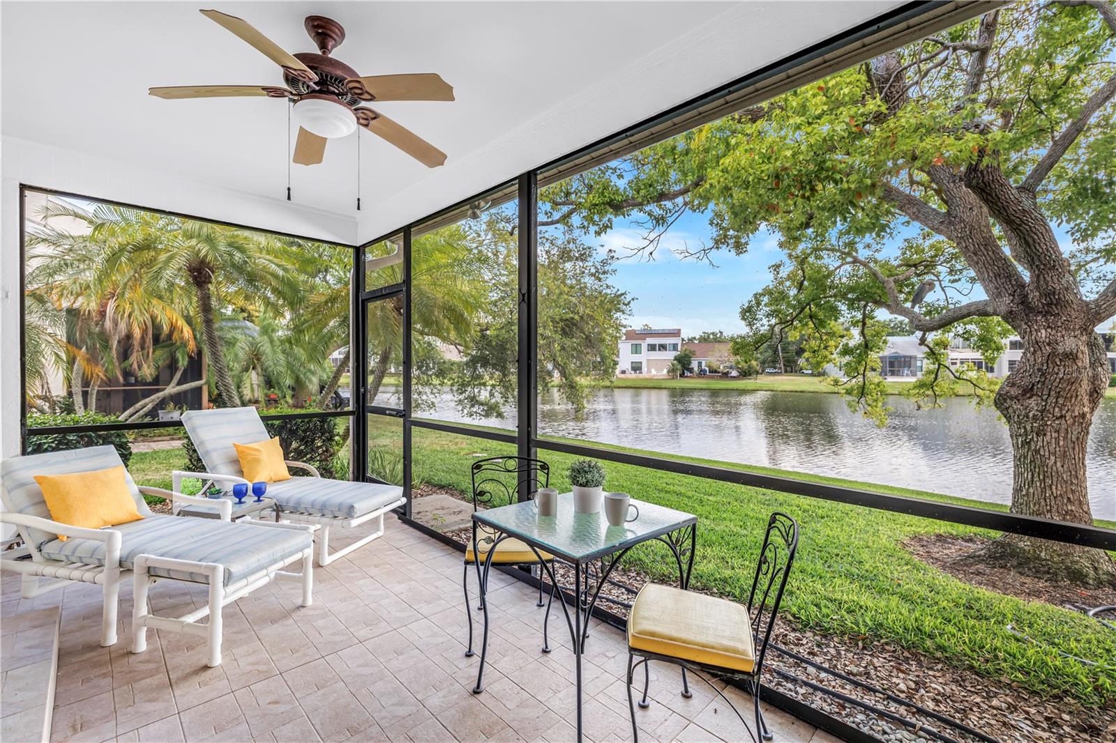 Exceptional Screened Back Patio with Shady Oak trees and long lake views