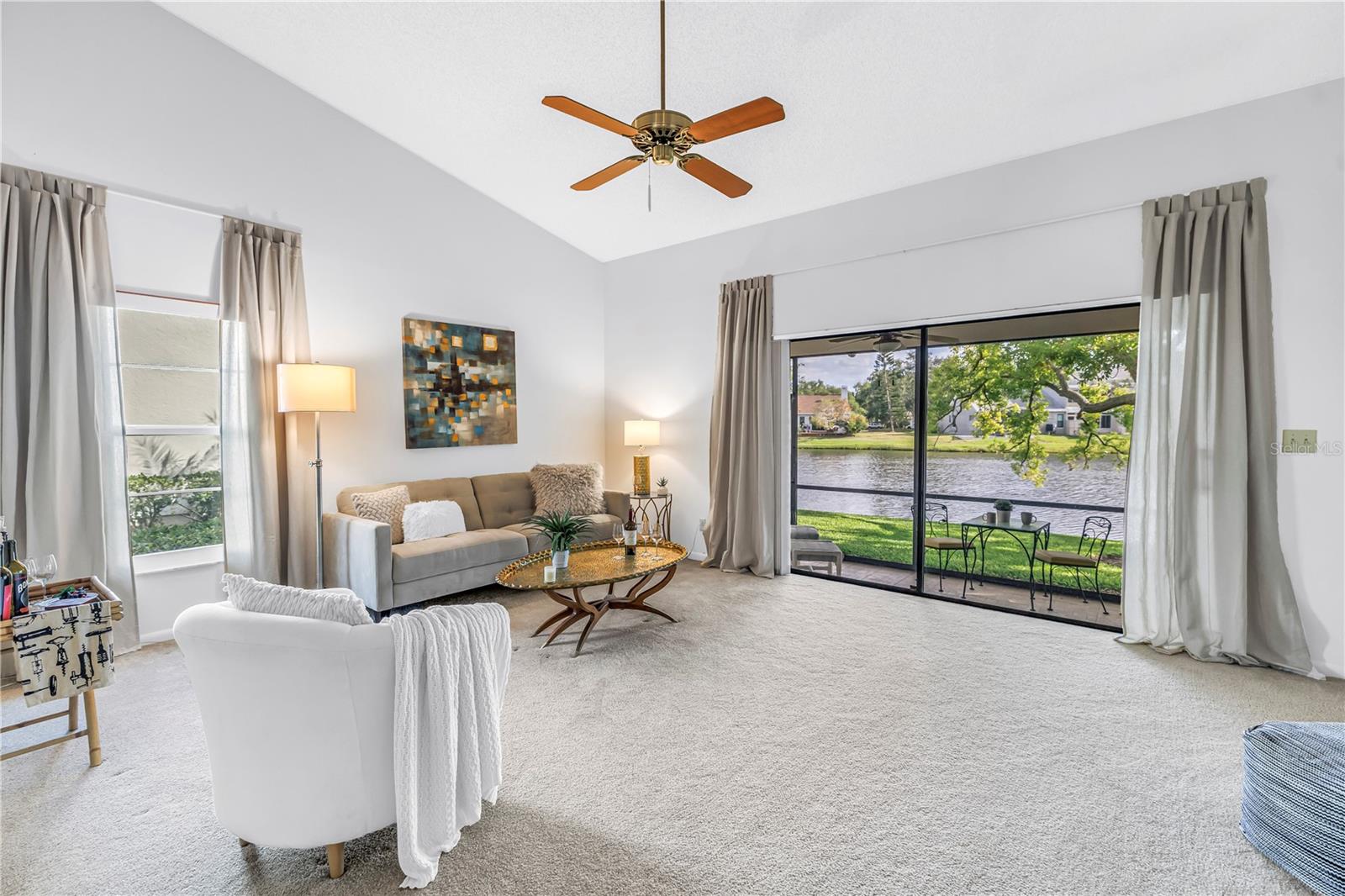 Amazing living space with wide glass sliders for a view and soaring vaulted ceilings