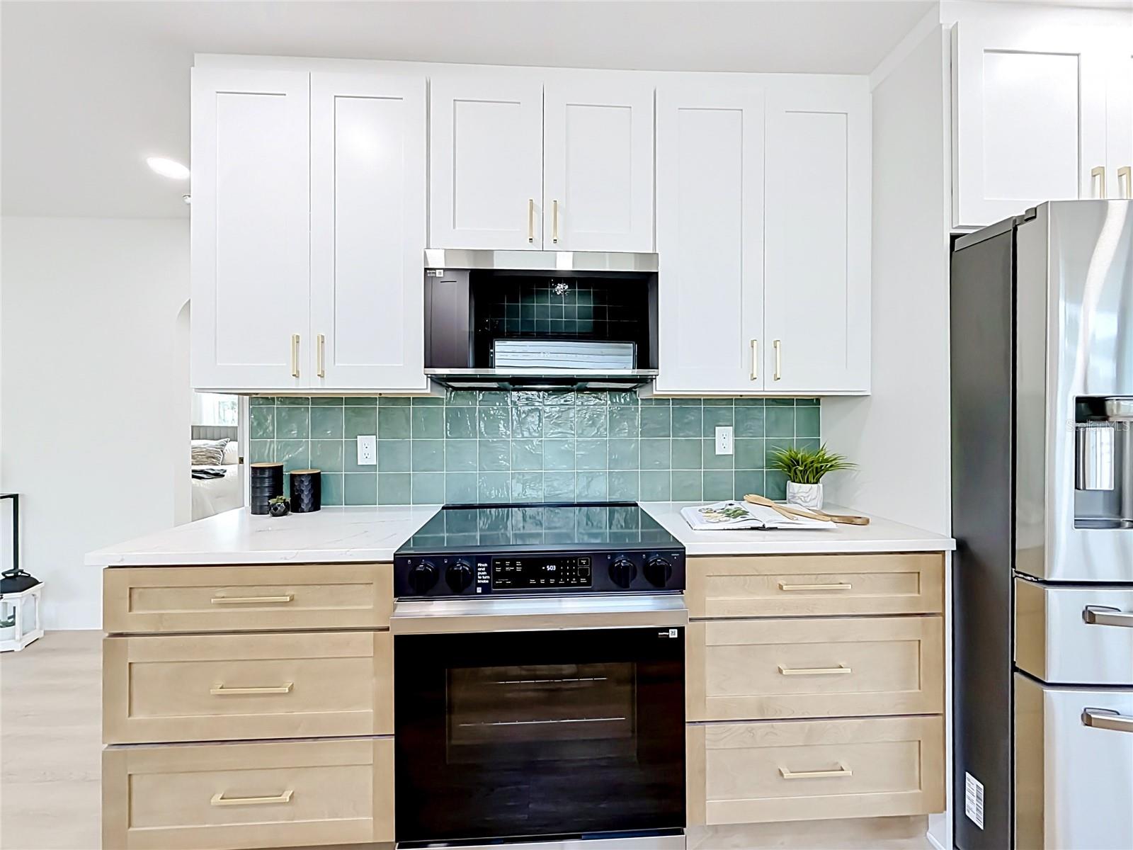 Kitchen with Two Toned Decorative Tile and Pull-Out Cabinets