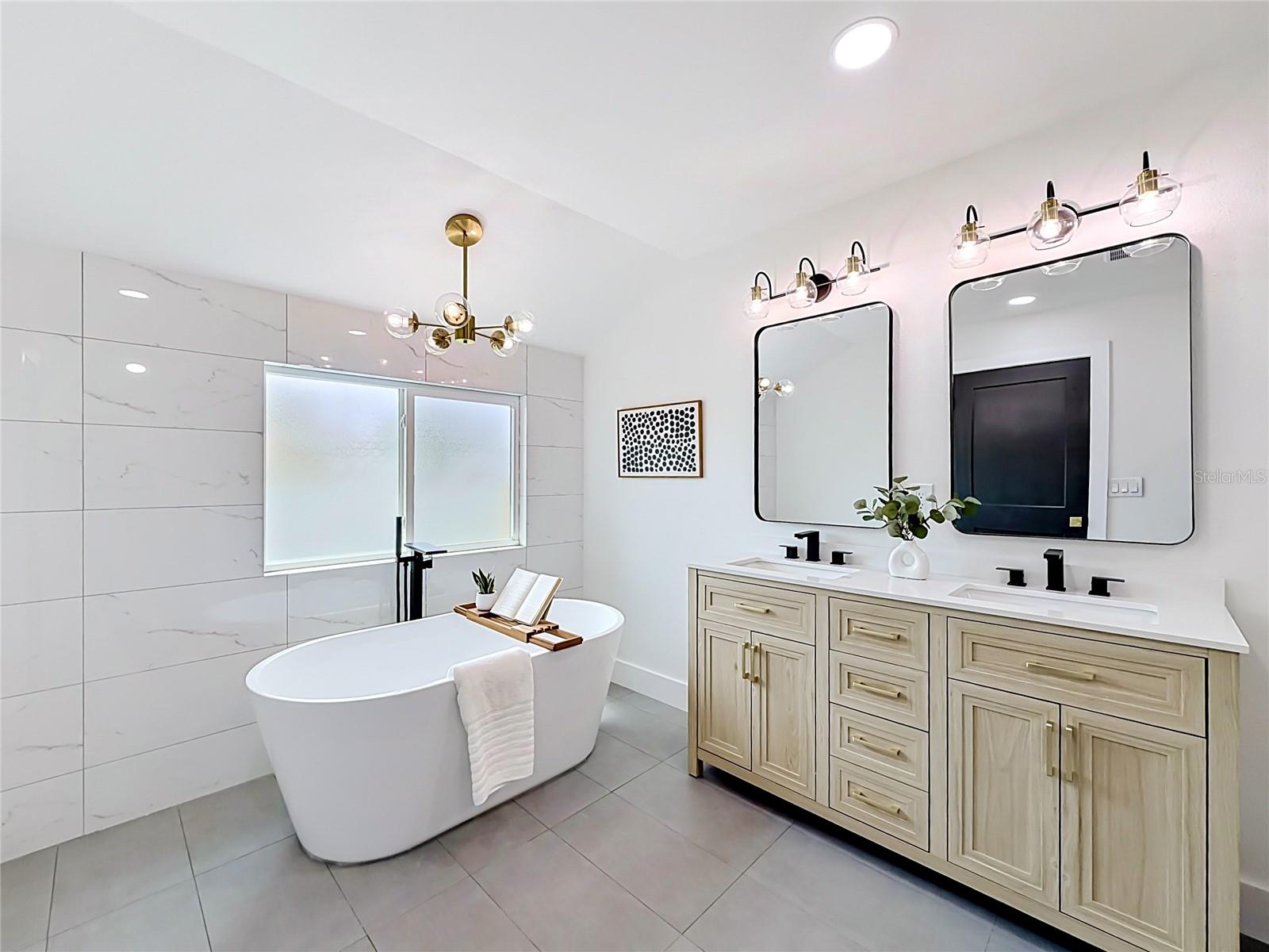 Primary Bathroom with Decorative Tile Accents, Double Vanity and Soaking Tub