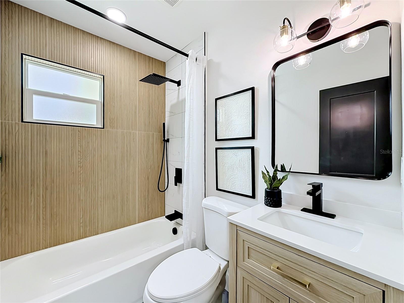 Guest Bathroom with Decorative Tile Accents