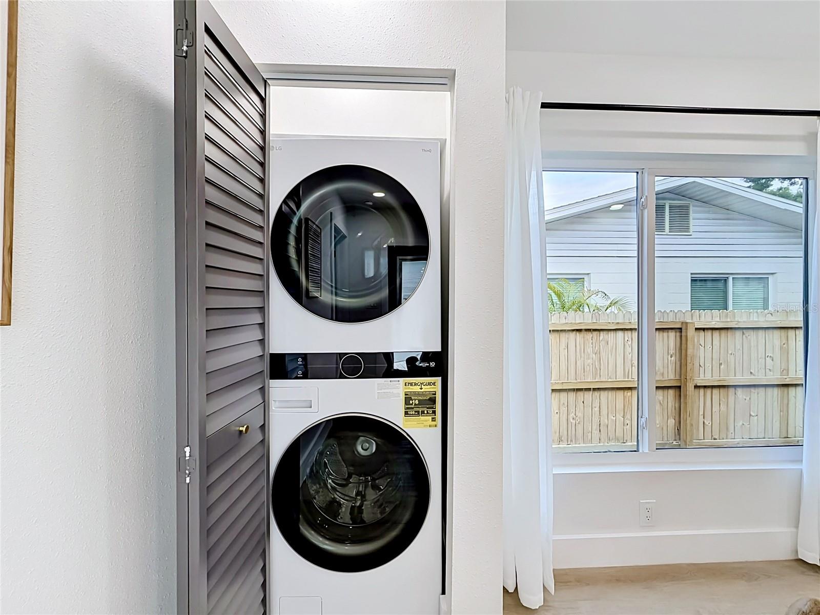 Laundry Closet with New Stackable Washer and Dryer