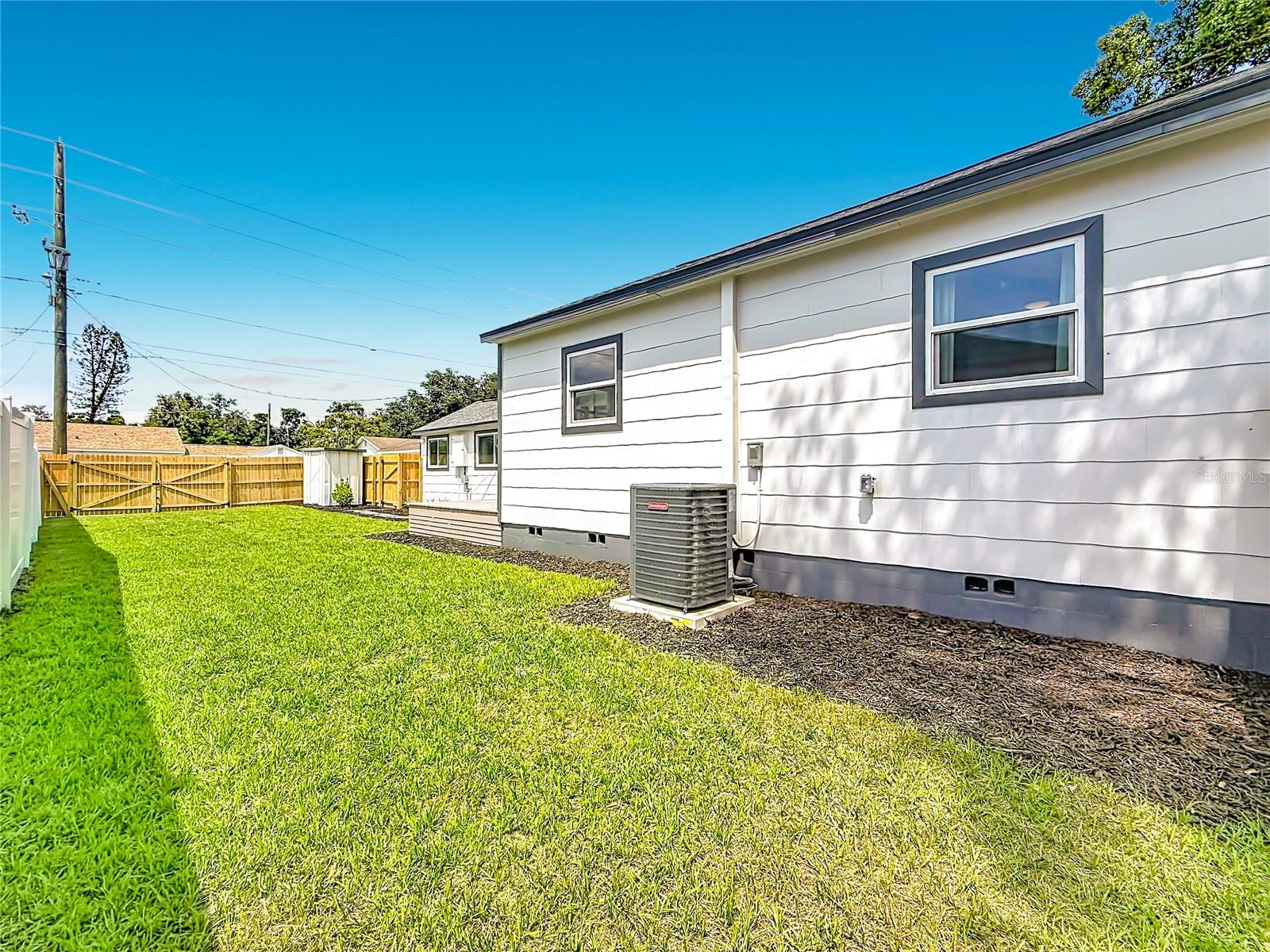 Freshly Landscaped Large Backyard with Double Gate and 2 Single Gates