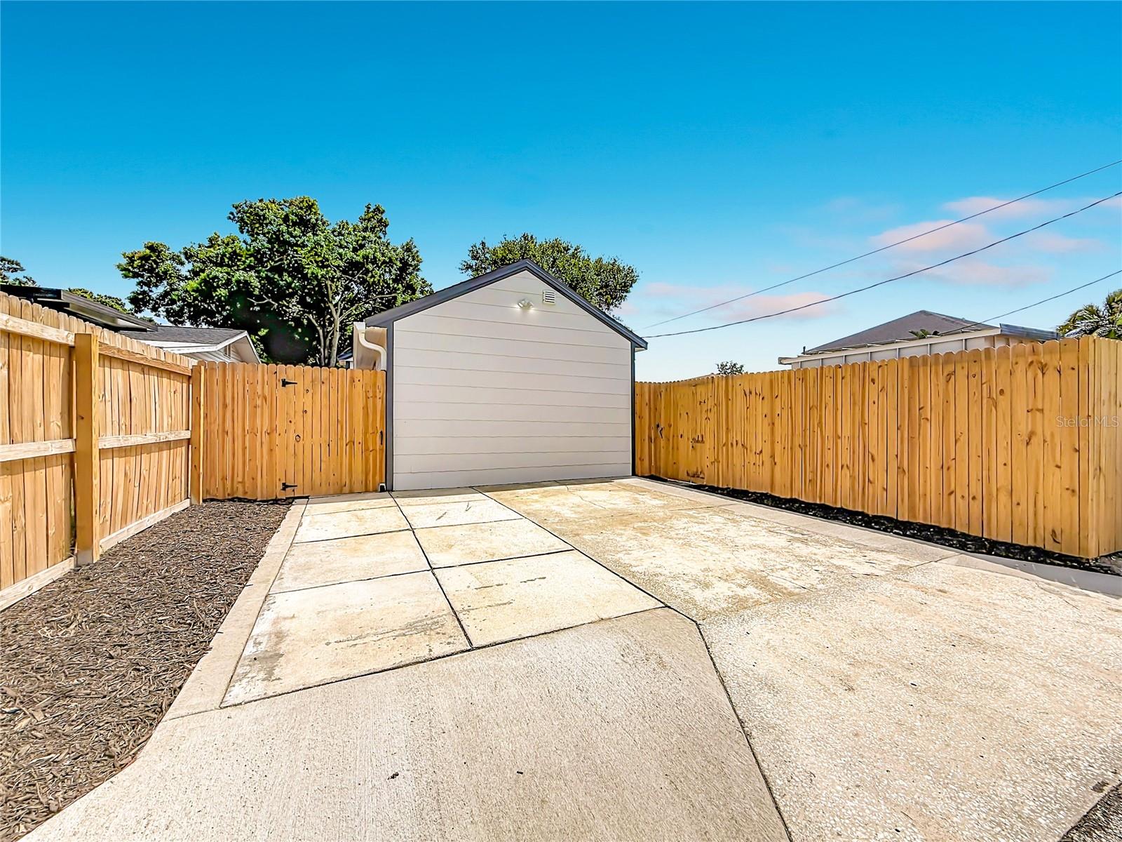 Large Driveway Off Alley and Fully Fenced In Backyard