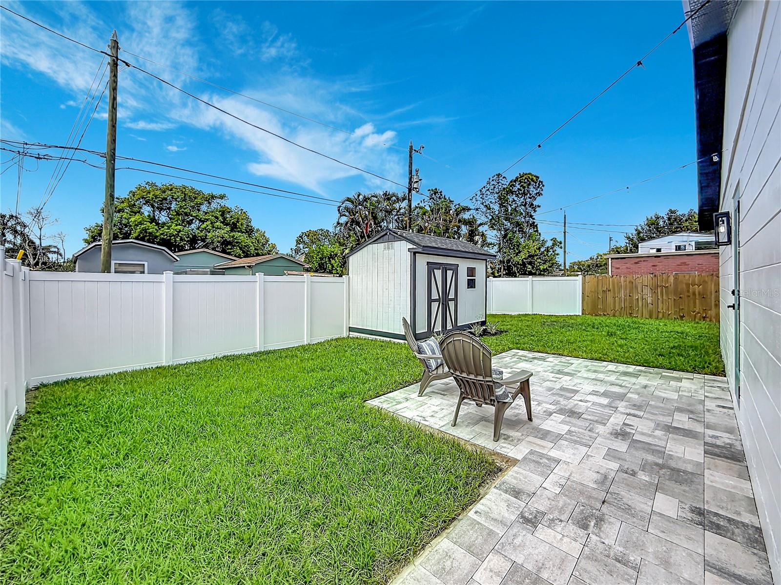Fully Fenced Large Backyard with Paver Patio and Walkway