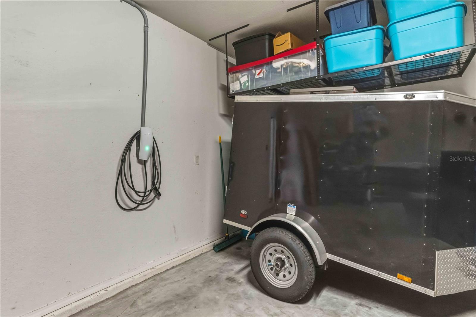 Tesla EV Charger and Overhead Storage in Garage