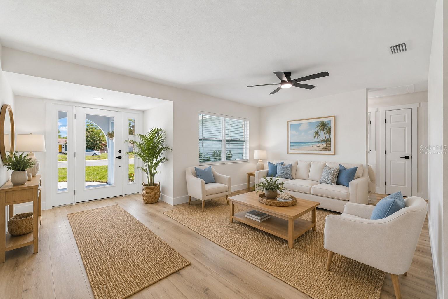 Entry and formal living. Virtually staged.