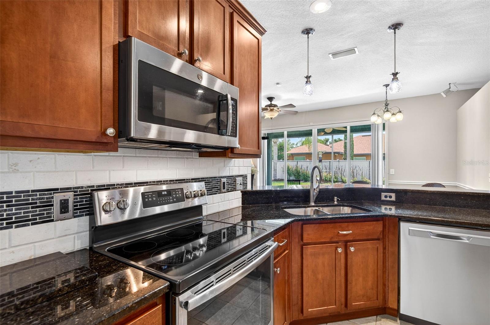 kitchen with pendant lights over bar