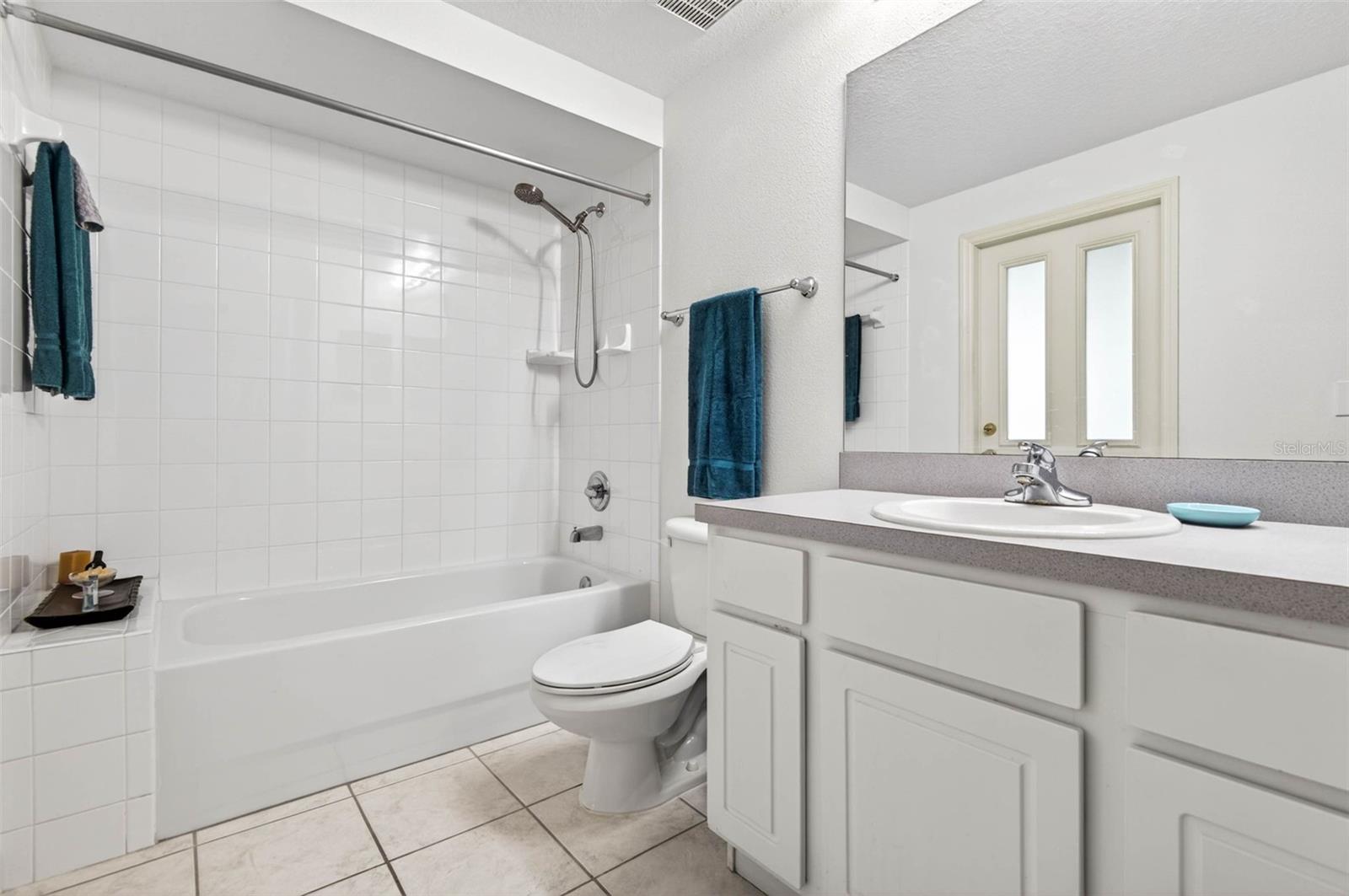 Secondary bath with tiled bench seat