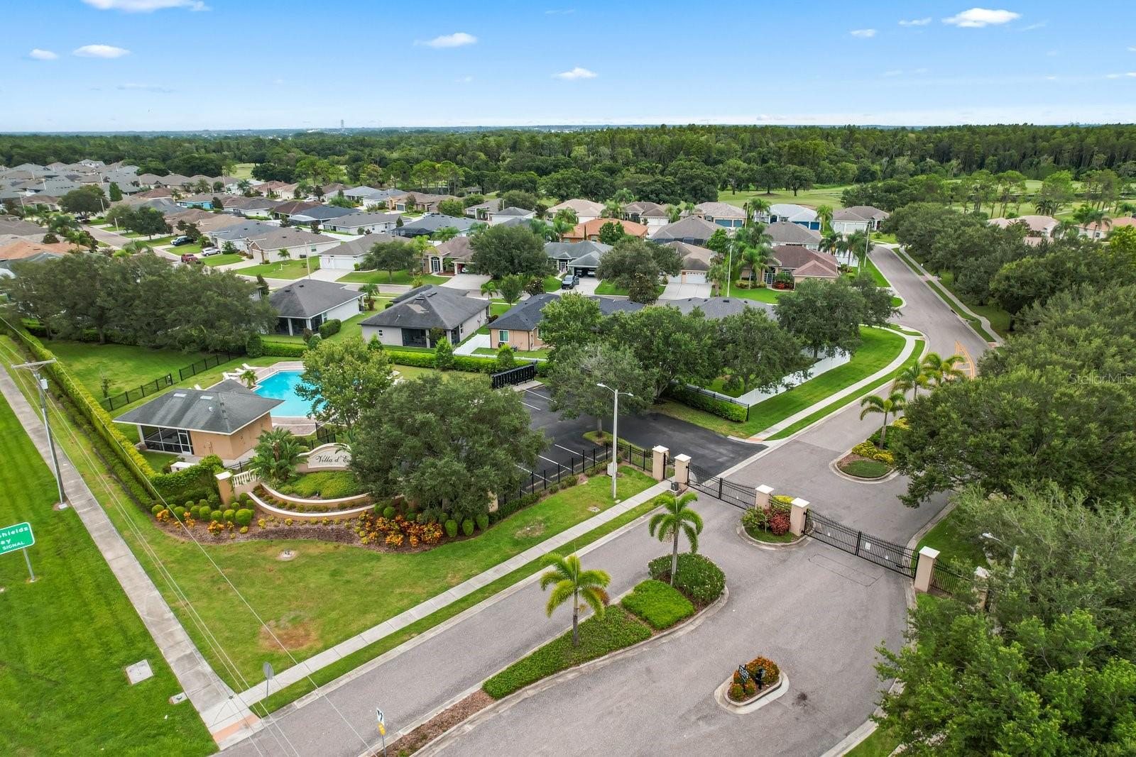 aerial view of pool by gated entry