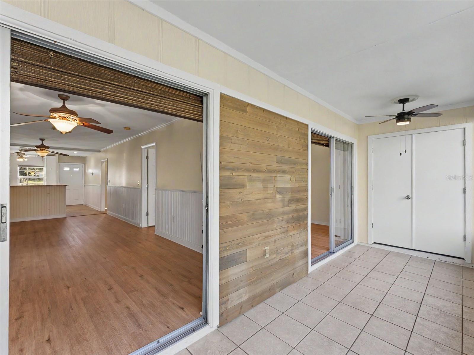 The enclosed porch has access from the primary bedroom and living room